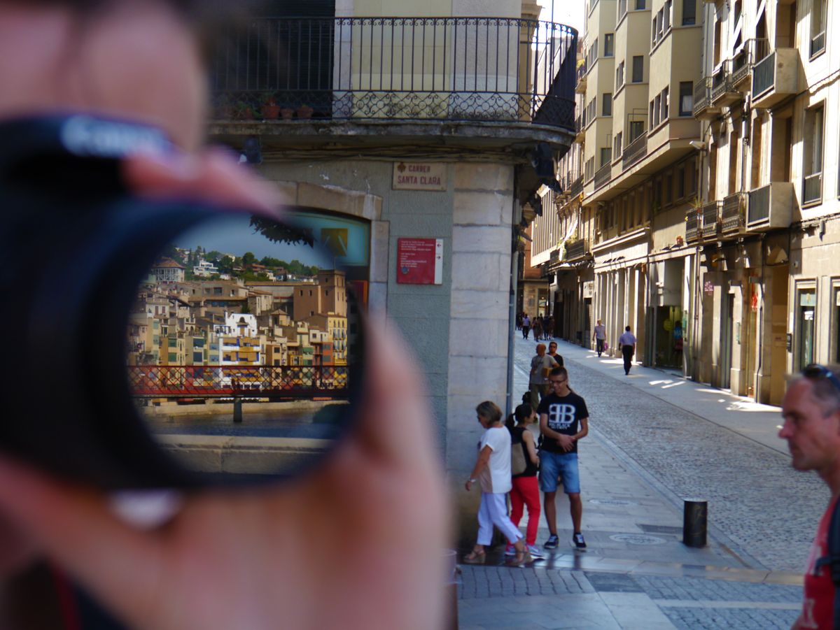 View on the Onyar river reflected in a lens